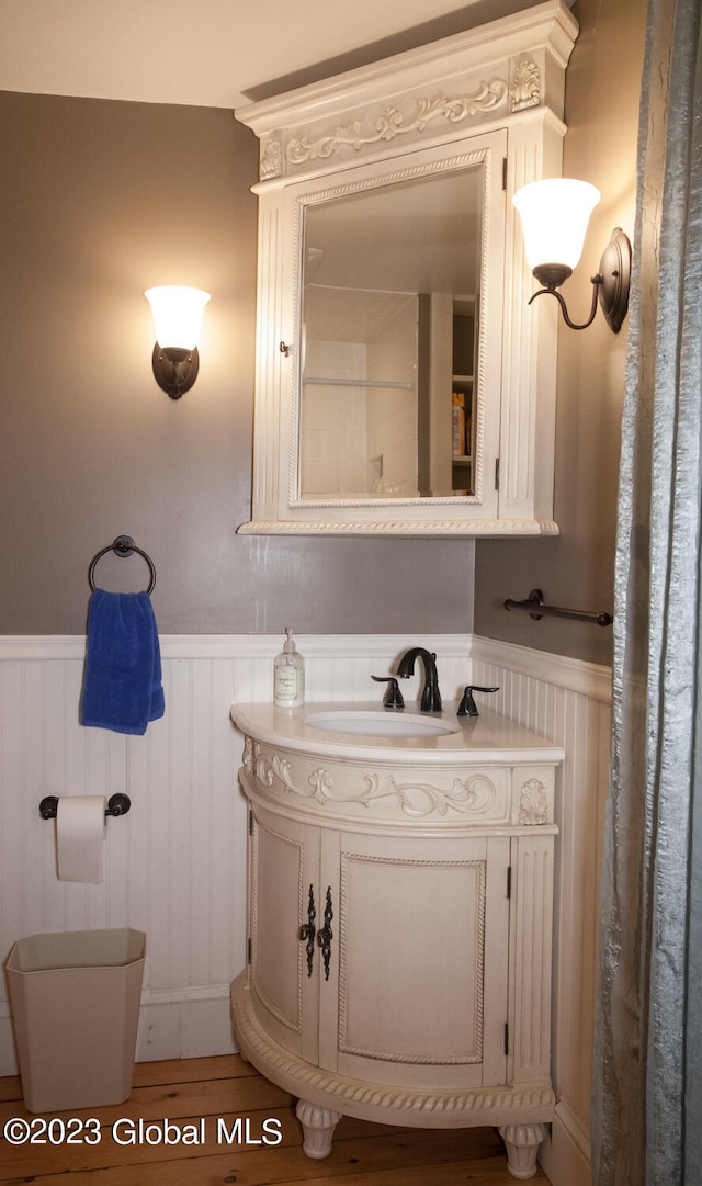 bathroom featuring hardwood / wood-style floors, vanity, and toilet