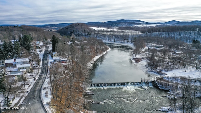 snowy aerial view featuring a mountain view