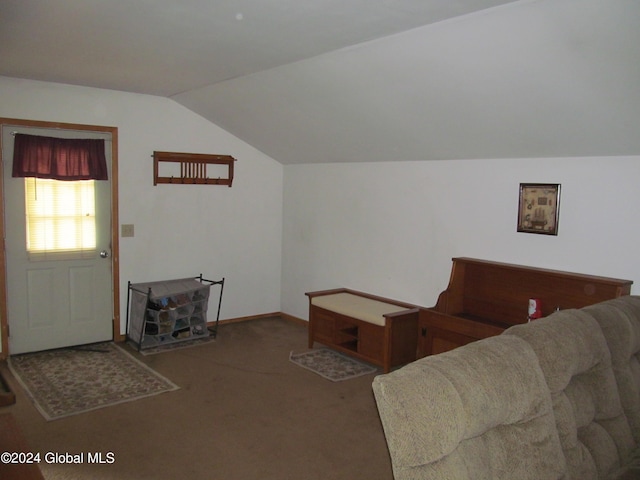 carpeted living room featuring lofted ceiling