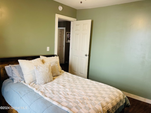 bedroom featuring dark hardwood / wood-style floors