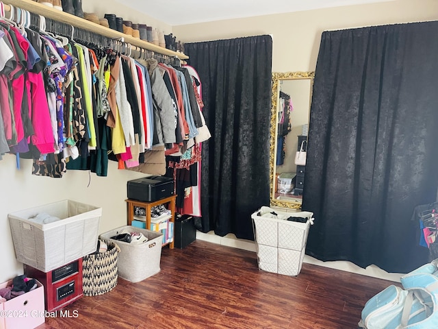 spacious closet with wood finished floors