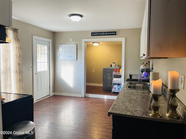 kitchen with dark hardwood / wood-style floors and sink