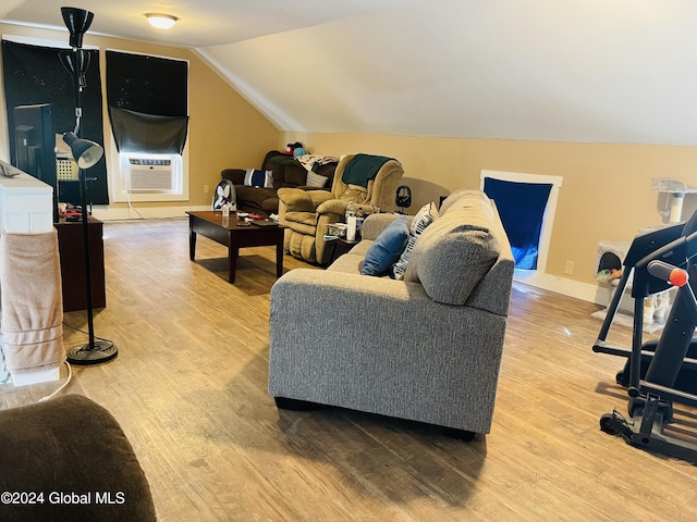 living room featuring wood-type flooring, cooling unit, and lofted ceiling