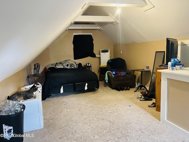 carpeted bedroom with vaulted ceiling