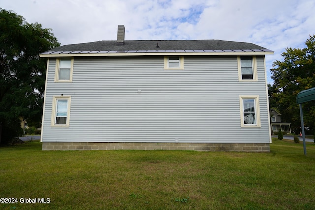 view of home's exterior featuring a lawn