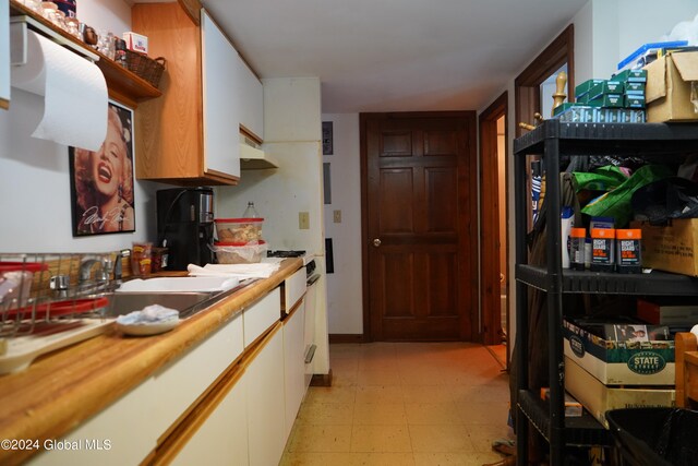 kitchen with white cabinets and sink