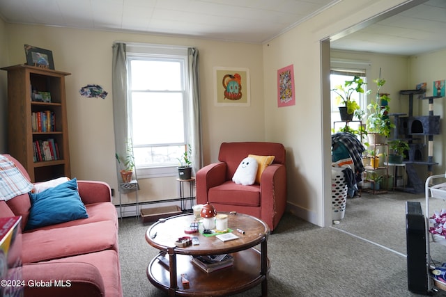 carpeted living room with ornamental molding, baseboard heating, and a healthy amount of sunlight