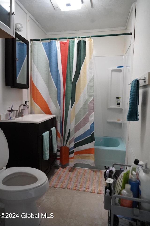 full bathroom featuring shower / bath combination with curtain, vanity, toilet, and a textured ceiling