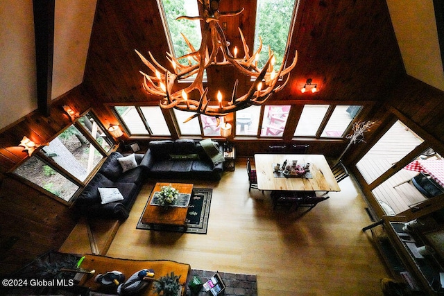 living room with a chandelier and wood finished floors