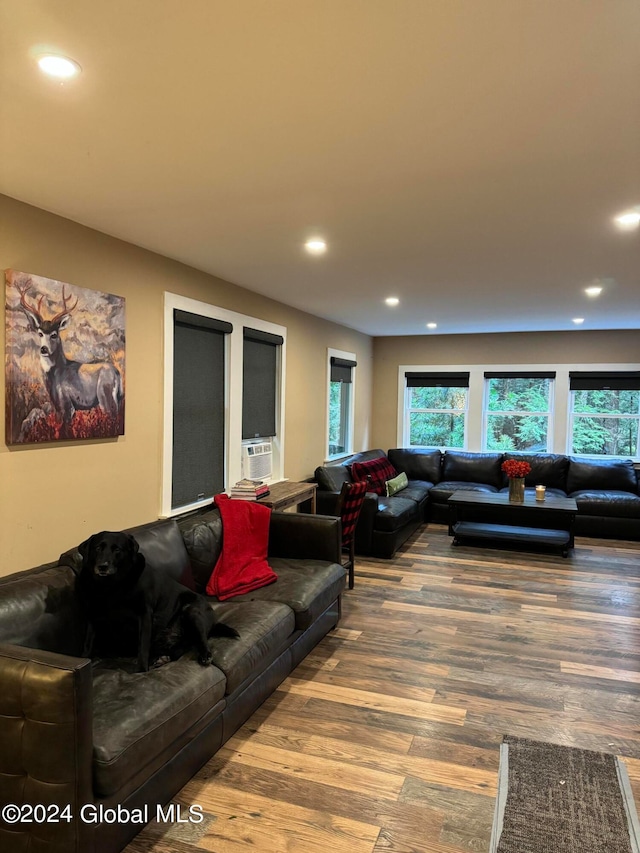 living room featuring recessed lighting, plenty of natural light, and wood finished floors