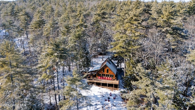 aerial view featuring a wooded view