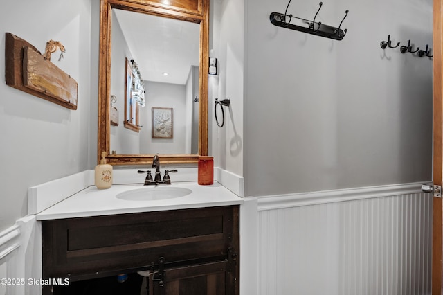 bathroom with vanity and wainscoting