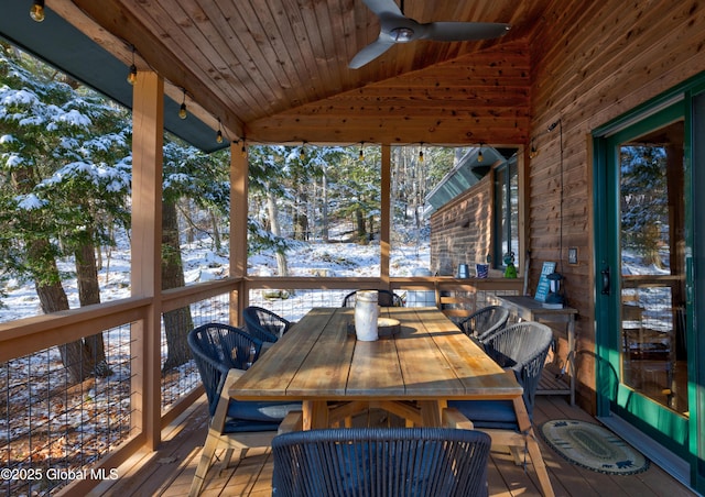 unfurnished sunroom featuring lofted ceiling, wood ceiling, and ceiling fan