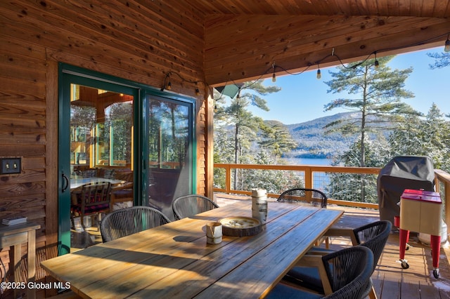 exterior space with outdoor dining area and a mountain view