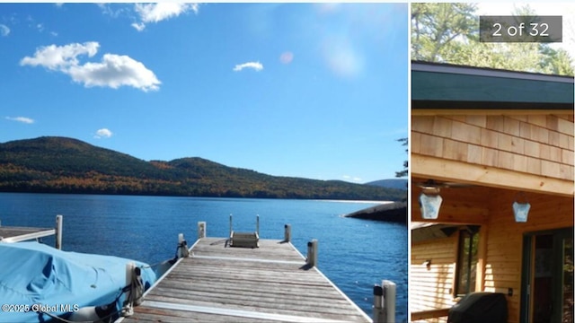 view of dock featuring a water and mountain view