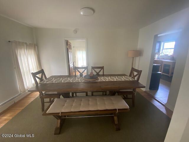 dining room with wood-type flooring