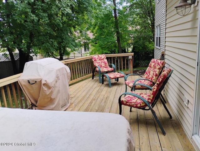 wooden terrace featuring grilling area