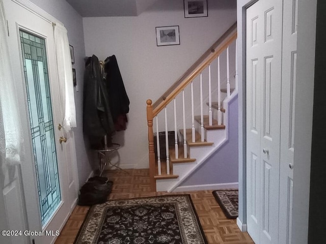 foyer entrance featuring parquet floors