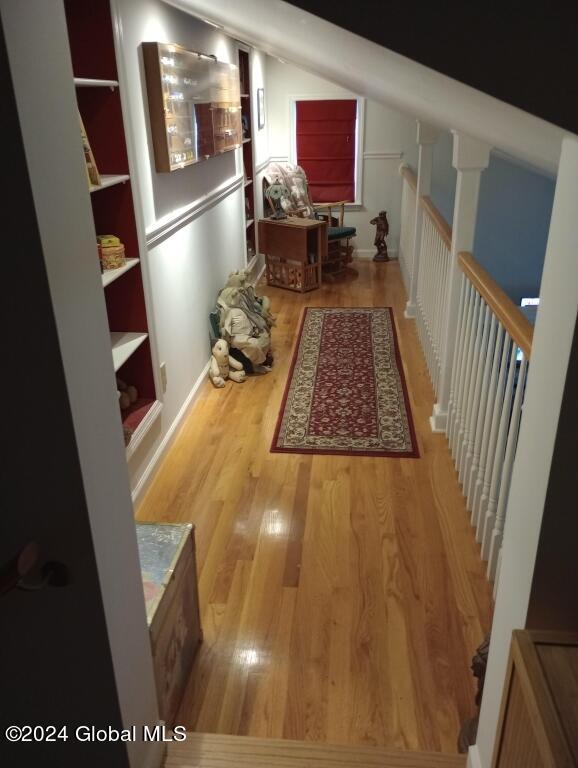 corridor featuring wood-type flooring