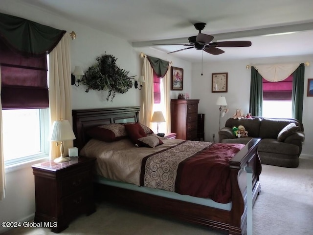 bedroom featuring ceiling fan and light carpet