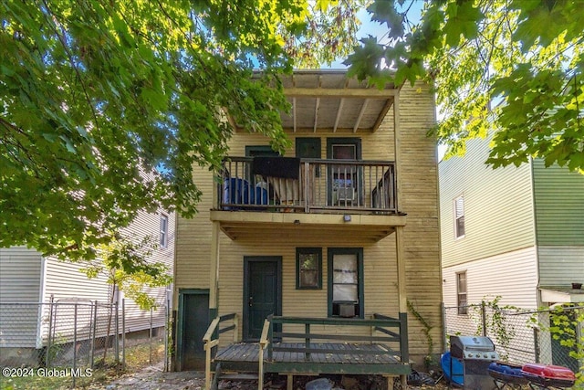 rear view of house with a balcony