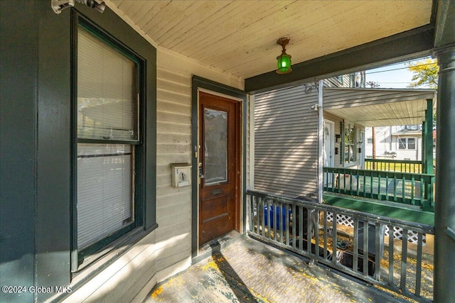 doorway to property featuring a porch