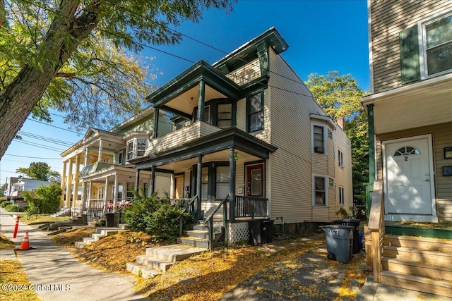 view of front of home featuring a porch and a garage