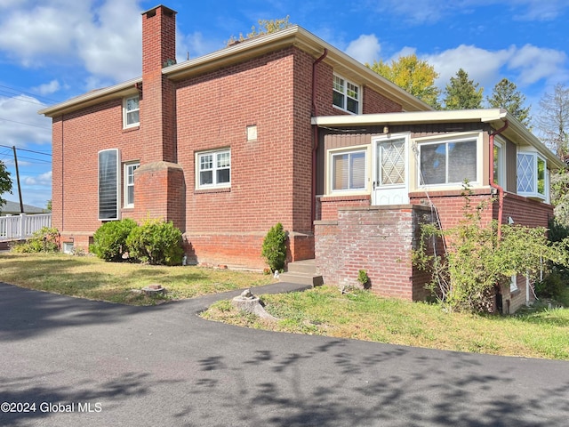 view of home's exterior featuring a lawn