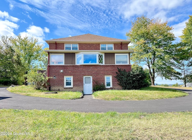 view of home's exterior featuring a lawn