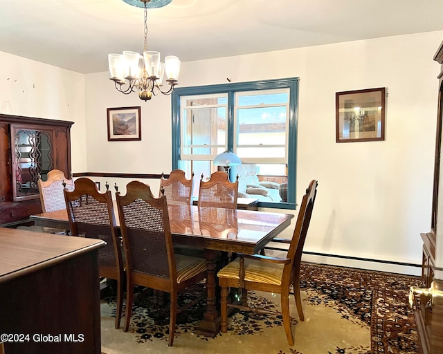 dining area featuring a notable chandelier