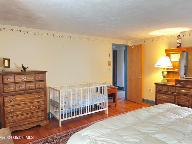 bedroom with hardwood / wood-style flooring