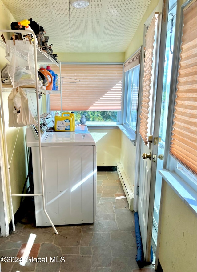 washroom featuring a baseboard radiator and independent washer and dryer