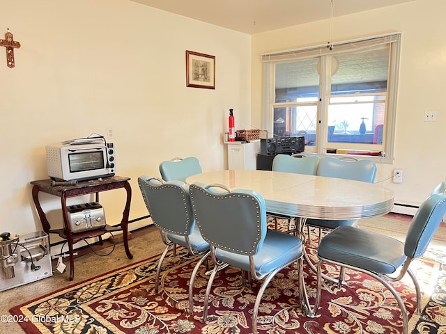 dining area with a baseboard heating unit