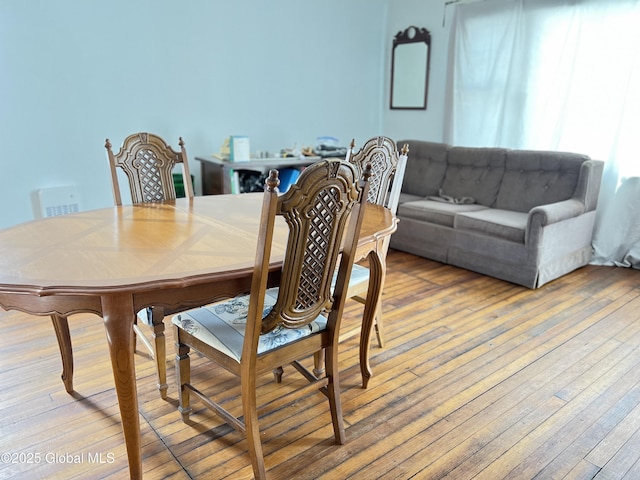 dining space featuring hardwood / wood-style flooring