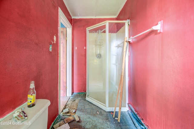 bathroom with crown molding and toilet