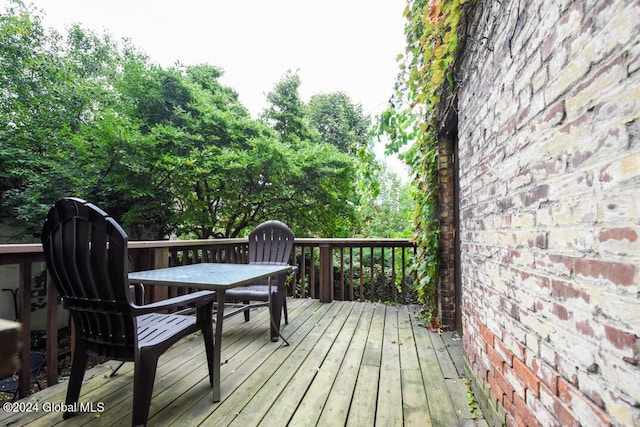 wooden deck with outdoor dining space