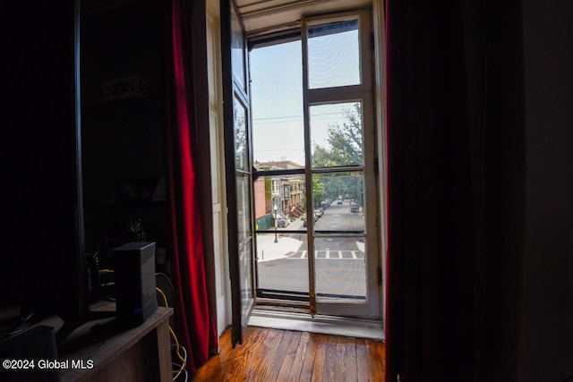 doorway to outside with wood finished floors