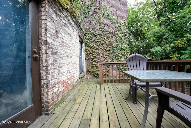 deck featuring outdoor dining area