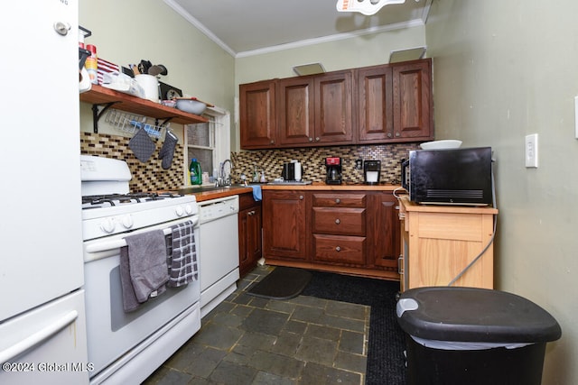 kitchen with sink, ornamental molding, white appliances, and tasteful backsplash