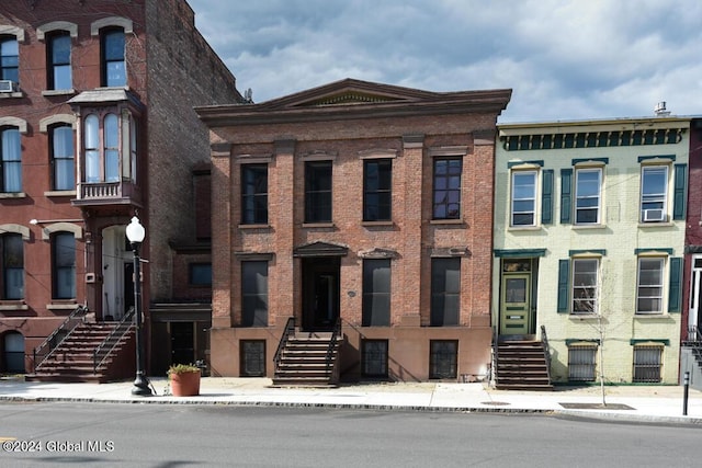 view of property with brick siding