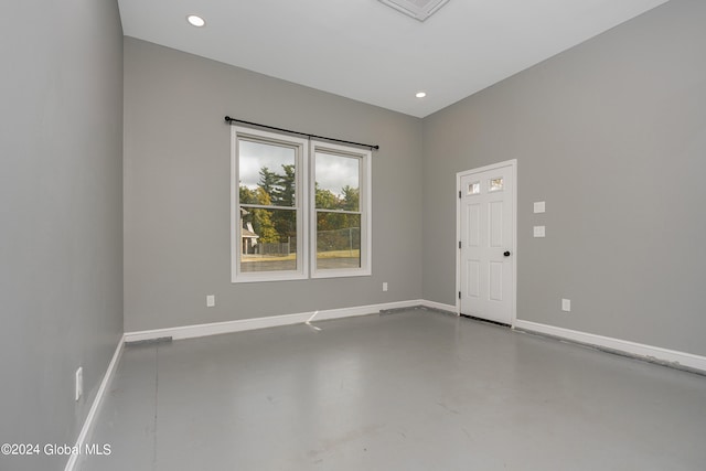 spare room with concrete floors