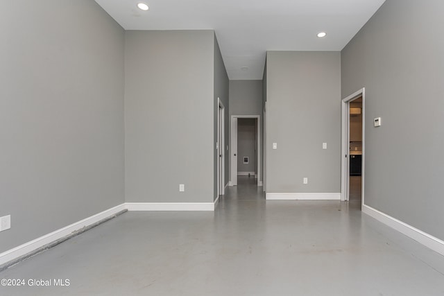 spare room featuring concrete flooring