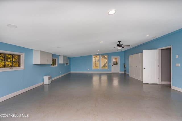 interior space with ceiling fan and lofted ceiling