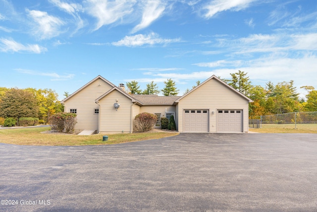 single story home with a garage