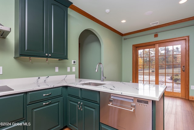 kitchen with crown molding, sink, light stone counters, kitchen peninsula, and hardwood / wood-style flooring