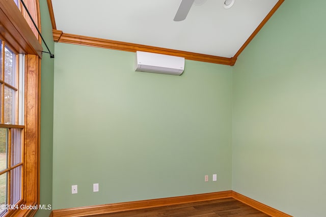 unfurnished room featuring ceiling fan, lofted ceiling, wood-type flooring, crown molding, and an AC wall unit