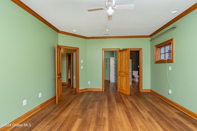 unfurnished bedroom featuring ceiling fan, dark hardwood / wood-style floors, and ornamental molding