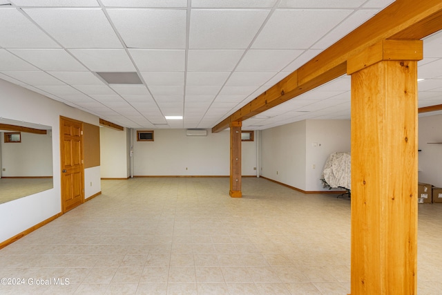 basement featuring a paneled ceiling