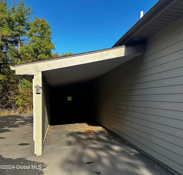 exterior space with a carport