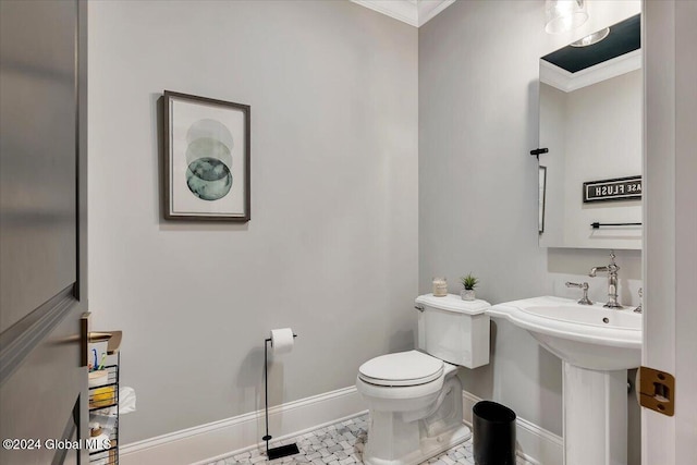 bathroom featuring toilet, baseboards, and ornamental molding